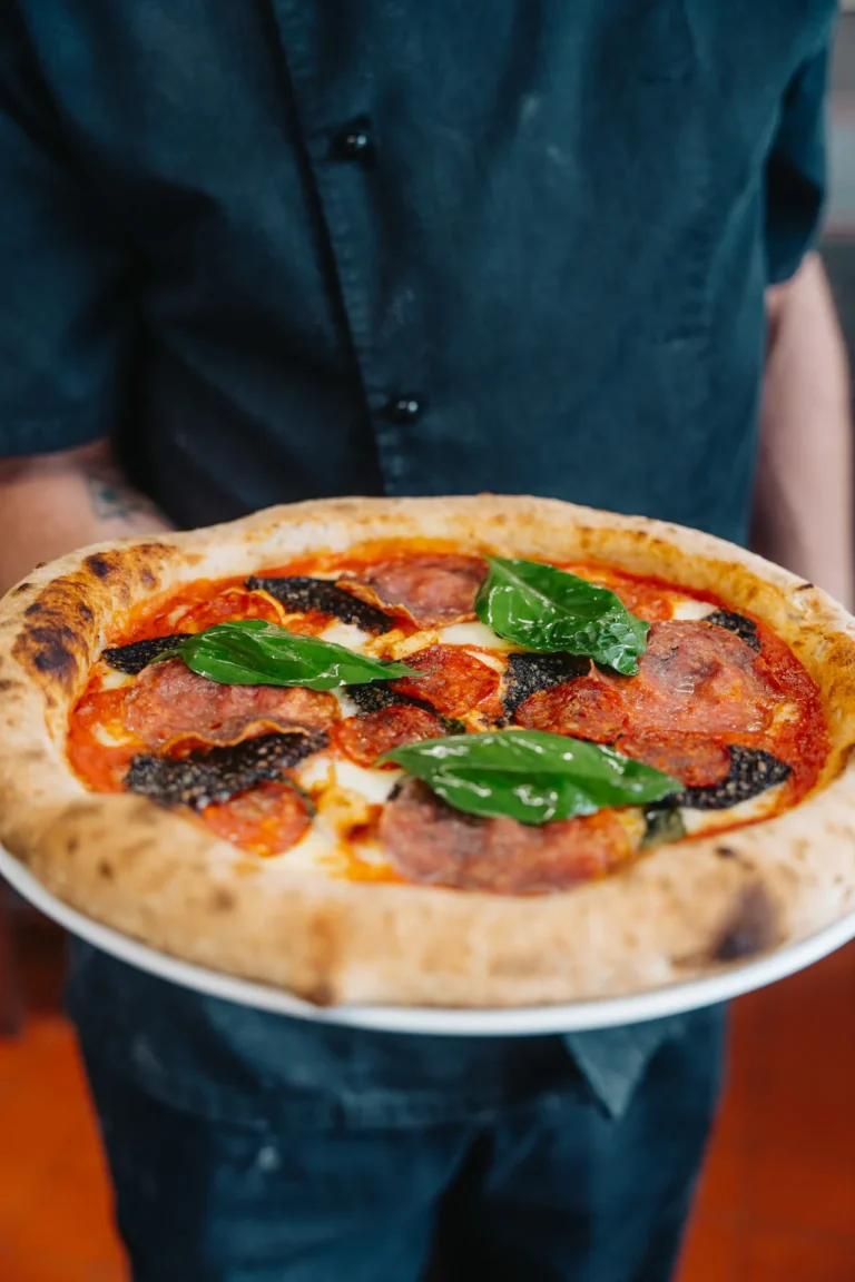 Freshly prepared pizza with basil