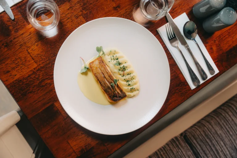 Plated fish with creamy potatoes