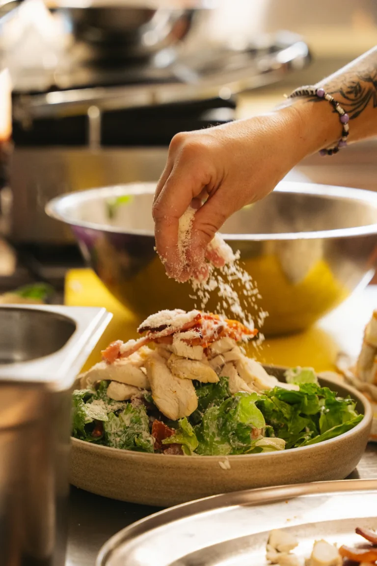 Adding the finishing touches to a salad